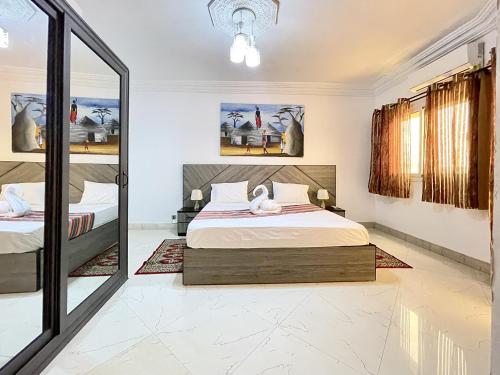 מיטה, Touraco Suite Hôtel Business (Touraco Suite Hotel Business) in Mbour מיטה, Touraco Suite Hôtel Business (Touraco Suite Hotel Business) in Mbour