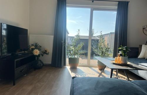 Shared lounge/TV area, Vakantiepark de Zeeuwse Parel - Zeebaars in Tholen Shared lounge/TV area, Vakantiepark de Zeeuwse Parel - Zeebaars in Tholen