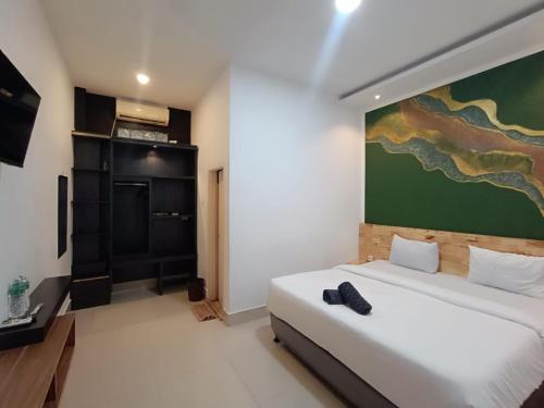 Közös társalgó / TV, D'Hills Hotel in Guguk Panjang Közös társalgó / TV, D'Hills Hotel in Guguk Panjang