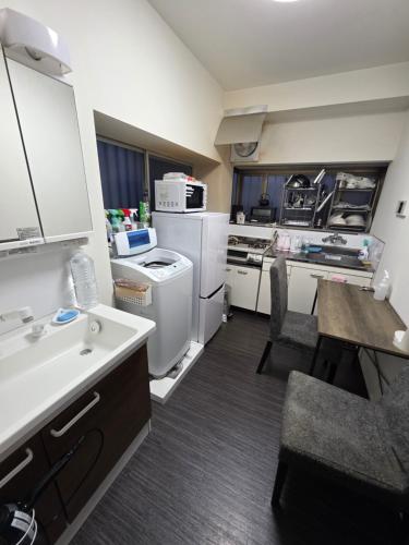 Shared lounge/TV area, Osaka Itami Airport NINN 大阪伊丹空港 にん in Minoh Shared lounge/TV area, Osaka Itami Airport NINN 大阪伊丹空港 にん in Minoh