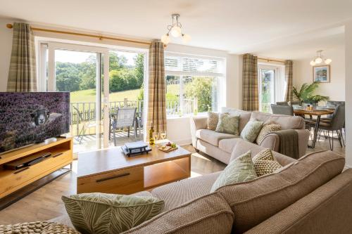 Shared lounge/TV area, FernLea - Cosy bungalow and stunning country views in Glaisdale Shared lounge/TV area, FernLea - Cosy bungalow and stunning country views in Glaisdale