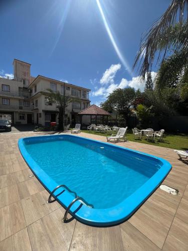 مسبح, Hotel e Pousada Recanto do mar in Santinho Beach مسبح, Hotel e Pousada Recanto do mar in Santinho Beach