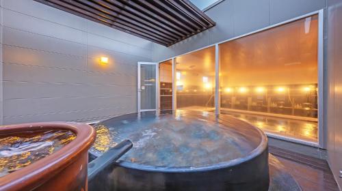 Bad in de openlucht, QuintessaHotel Fukuokawatanabedouri Comic&Books in Fukuoka Bad in de openlucht, QuintessaHotel Fukuokawatanabedouri Comic&Books in Fukuoka