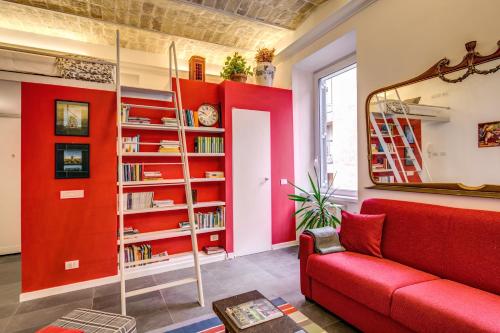 This photo about AwesHome - Colosseo Red Design shared on HyHotel.com