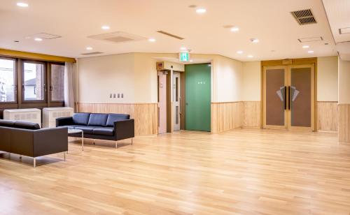 Shared lounge/TV area, NARA Visitor Center and Inn near Mt. Wakakusa Shared lounge/TV area, NARA Visitor Center and Inn near Mt. Wakakusa