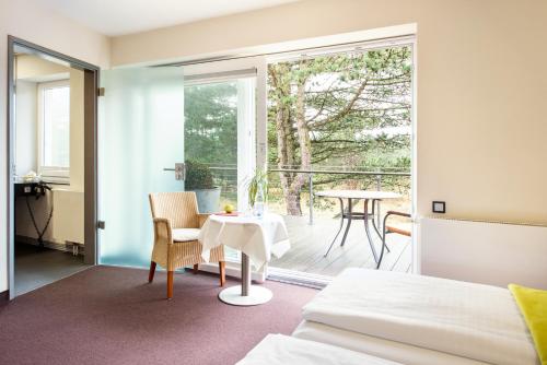 Terraza/balcón, Hotel Windschur in Sankt Peter-Ording Terraza/balcón, Hotel Windschur in Sankt Peter-Ording