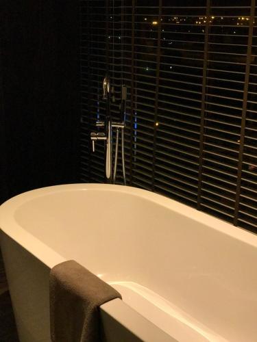 Bathroom, Roseate House New Delhi in New Delhi and NCR Bathroom, Roseate House New Delhi in New Delhi and NCR