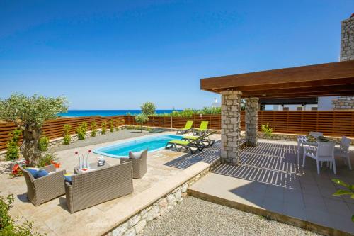 This photo about Antonoglou Beach Villas - Waterfront Luxury Retreat shared on HyHotel.com