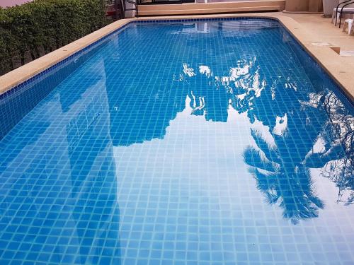 This photo about Flame Tree Residence 2-Bedroom Apartment shared on HyHotel.com