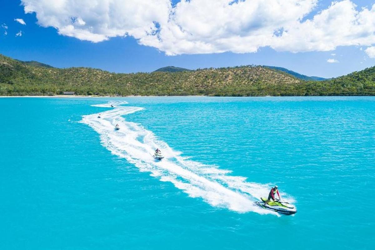 a group of people on a boat in the water