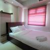 Homey and Relaxing 2BR Green Pramuka Apartment By Travelio