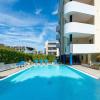 Green Holiday Flat with pool close to the beach