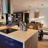 Logement 100m² industriel avec jardin et terrasse