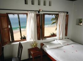 Foto di Hotel: Karikkathi Beach House