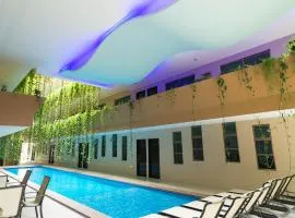 Palmarena Rooms & Residences - Long Stay Comfort with Parking, Sauna, Gym & Pool - Steps from 5th Avenue