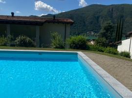 Zdjęcie hotelu: Bellissimo appartamento con giardino sul lago di Lugano