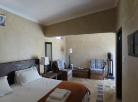 Sunset Lodge & Safaris, ξενοδοχείο σε Guernsey Nature Reserve