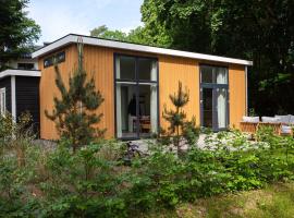 A picture of the hotel: Modern house with dishwasher, on a holiday park in a nature reserve