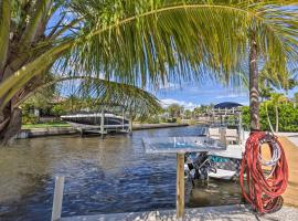 Hotel fotoğraf: Palm City Canalfront Home with Tiki Hut and Dock!