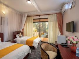 รูปภาพของโรงแรม: Entebbe Traveller's Hotel