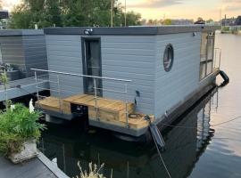 A picture of the hotel: Unique new houseboat moored 4