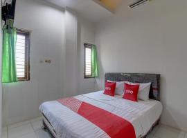 รูปภาพของโรงแรม: Capital O 91690 Moza Guest House