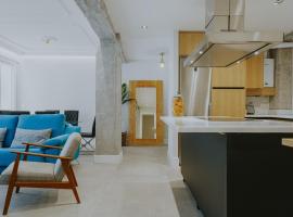 Foto do Hotel: Six Apartments by Caleta Homes