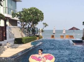 รูปภาพของโรงแรม: The Vimanlay Beachfront Condo Retreat