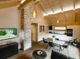 Chalet 49 Nesselgraben - Ferienwohnungen aus Holz, hotel in Koppl