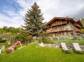 Foto di Hotel: Le Vieux Noyer - Appartamenti al Verde villaggio di Rumiod