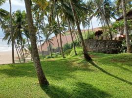 होटल की एक तस्वीर: Karikkathi Beach Villa rooms
