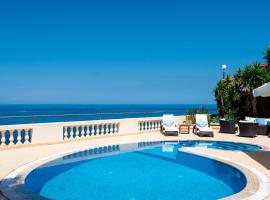 Hotel Foto: Villa Palma - Sunset Sea Views with Pool, Jacuzzi, Sauna and Games Room