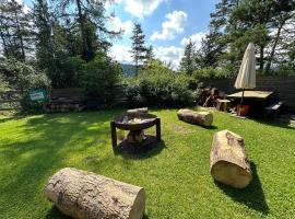 Foto di Hotel: Ferienhaus im Wald