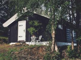 Hotel foto: Sjarmerende tømmerhytte på gårdstun