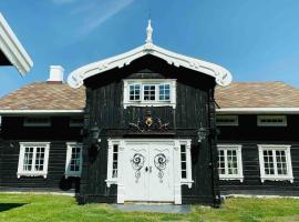 Eventyrlig Tømmerhytte på Gårdstun, Hotel in Vinstra