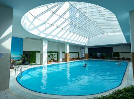 19th Floor Cozy Condo with Pool, Fitness, Parking Included in Price & Self Check in Available, hotel in Skopje