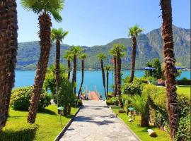 Idyllische Ferienwohnung in Bissone, hotel en Bissone