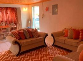 Lovely 2 bedroom condo with WiFi in a quiet area, 7-10 minutes away from both the airport and Oistins, hotel in Christ Church