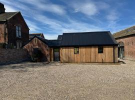 होटल की एक तस्वीर: The Stables, Modern 2 bed, 4 person, Rural Barn Conversion with Great Access