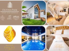 Olivina Park Spa - domki z dostępem do krytego basenu, saun, wyżywienia i atrakcji dla dzieci, hotel em Niechorze