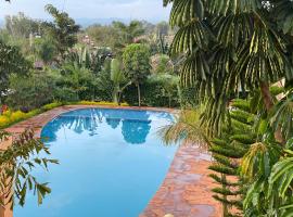 Maanet Gardens Hotel, hotel in Kutu