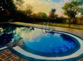 Hotel Jungle Palace Resort, hôtel à Umariā