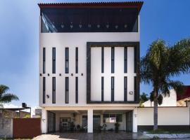 Capital O Hotel Joyma Suites, San Luis, hôtel à San Luis Potosí