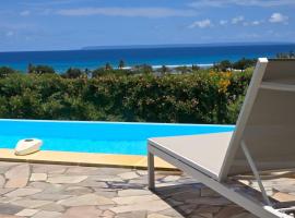 Les villas "Fenêtres Sur Plage" - Villas Créoles de charme , vue exceptionnelle face mer et plage & piscines privées à débordement, hotel a Saint-François
