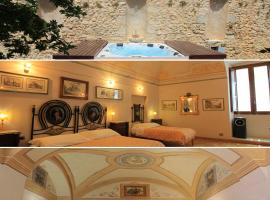 Palazzo Rustici charme b&b & garden spa, hôtel à LʼAquila