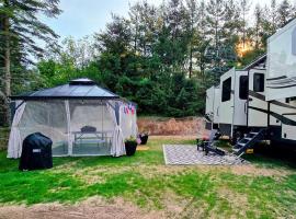 Luxury RV on 10 Private Acres Bring your pup, hotel in Boyne City