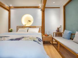 Qixia Guanjing Meisu Inn, hôtel à Lijiang