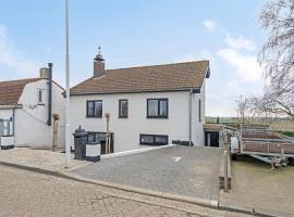 Graafjansdijk B Vakantiehuis met 3 slaapkamers net over de Belgische grens, hotel in Westdorpe