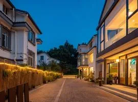 The Tea & Bamboo Retreat A serene homestay offering complimentary bamboo weaving workshops and tea tasting experiences.