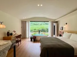 The Tea & Bamboo Retreat A serene homestay offering complimentary bamboo weaving workshops and tea tasting experiences.